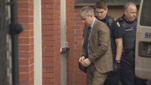 Dennis Oland is escorted into the Justice Building in Fredericton in February for a bail hearing. The 48-year-old financial adviser was convicted of second-degree murder in the 2011 killing of his father, Richard Oland. Photo: CBC News